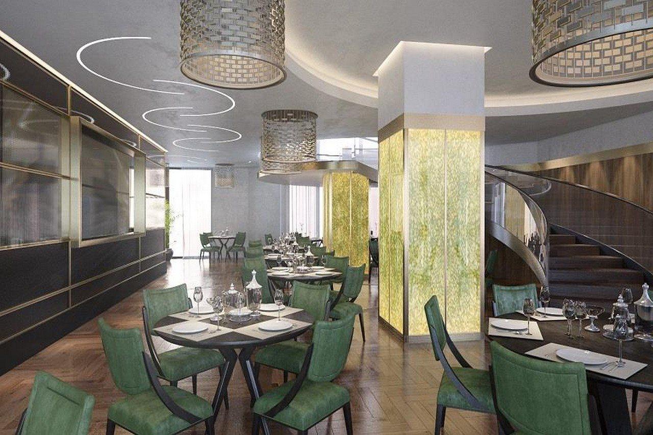 Grand Swiss-Belhotel Waterfront Seef Sanabis Exterior foto The photo shows an elegantly designed restaurant interior. It features a mix of modern and sophisticated elements, with stylish green chairs around neatly set tables that include white tablecloths, plates, and cutlery. The lighting is provided by uni